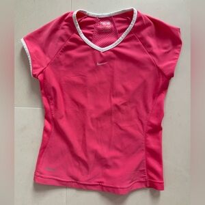 Nike Pink Sports jersey with White Accents.  Perfect for a tennis lesson.